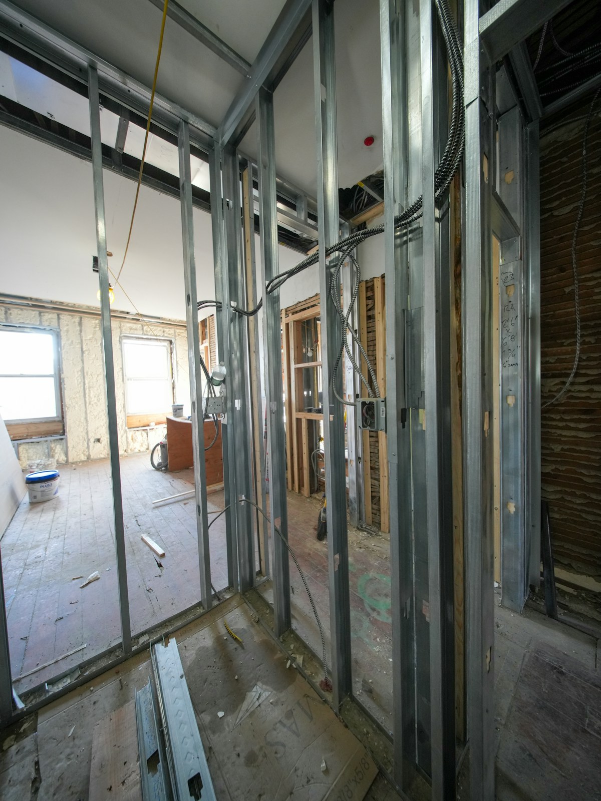 Interior renovation in progress with exposed framing